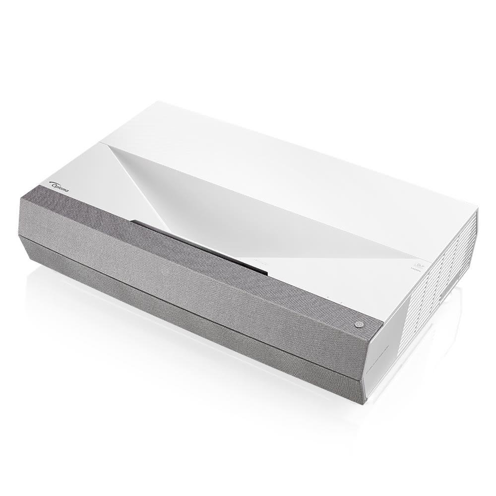 Optoma奧圖碼 CinemaX Optoma奧圖碼 CinemaX D2+ 是一款高效能4K超短焦雷射投影機,適合商務與家用劇院使用。具備3000流明亮度、1,800,000:1高對比度,以及0.25:1投射比例,只需30cm距離即可投影100吋大畫面。支援4K Ultra-HD解析度(3820x2160)、16:9畫面比例,內建喇叭與雷射光源,燈泡壽命長達30,000小時(Eco模式)。白色系設計,尺寸576x383x130mm,重量輕巧,保固三年以上,BSMI認證R43081,完美實現居家娛樂與專業投影需求。